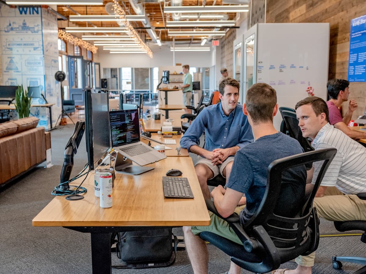 Colleagues on a video call together at a laptop