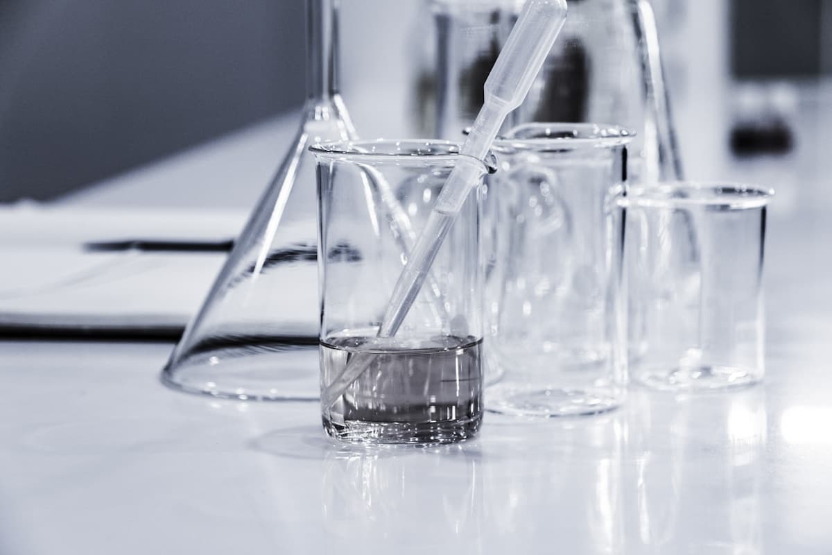 Research notes and a microscope in a science workspace