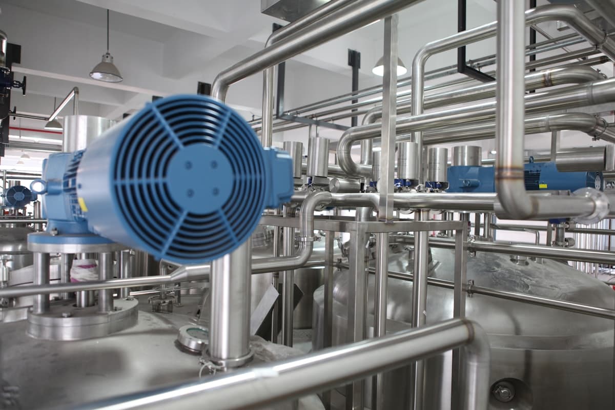 Factory workers and industrial equipment on a production floor
