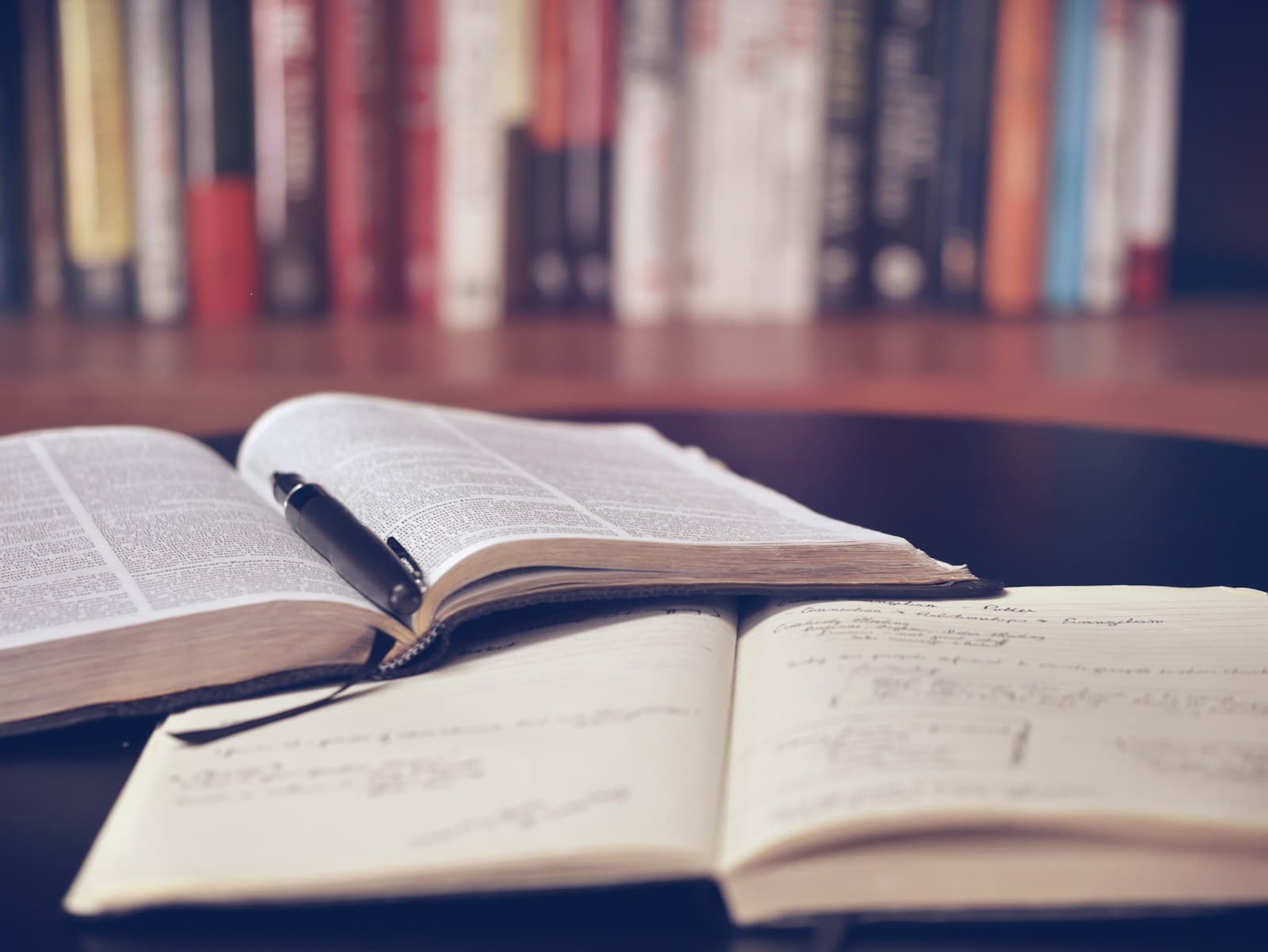 Stack of books and learning materials on a desk